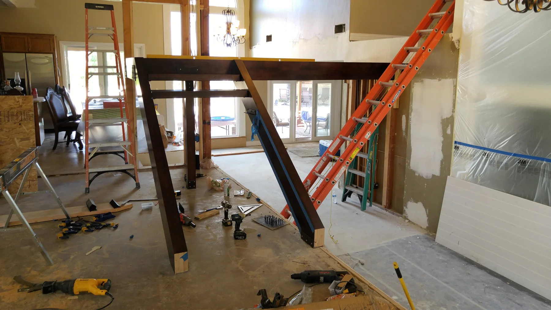 Corona custom stair rebuild project by PL Builders showing custom stair framing and steel support during rebuild
