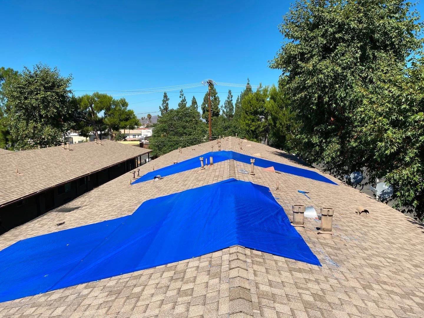 Roof protection and repair planning: Hemet apartment fire and smoke damage restoration documentation by PL Builders