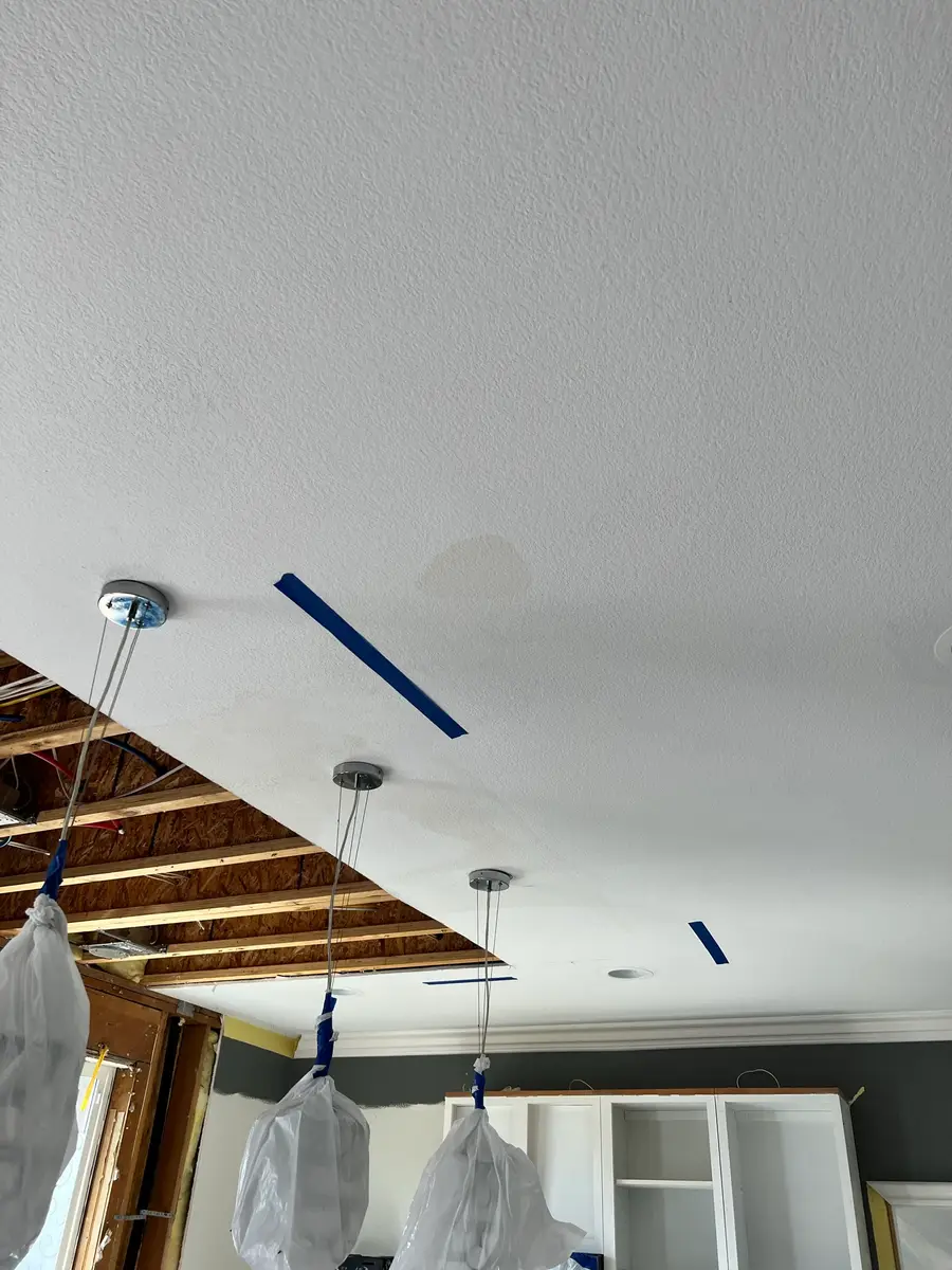 Kitchen ceiling marked before selective drywall removal during San Jacinto water damage restoration project by PL Builders