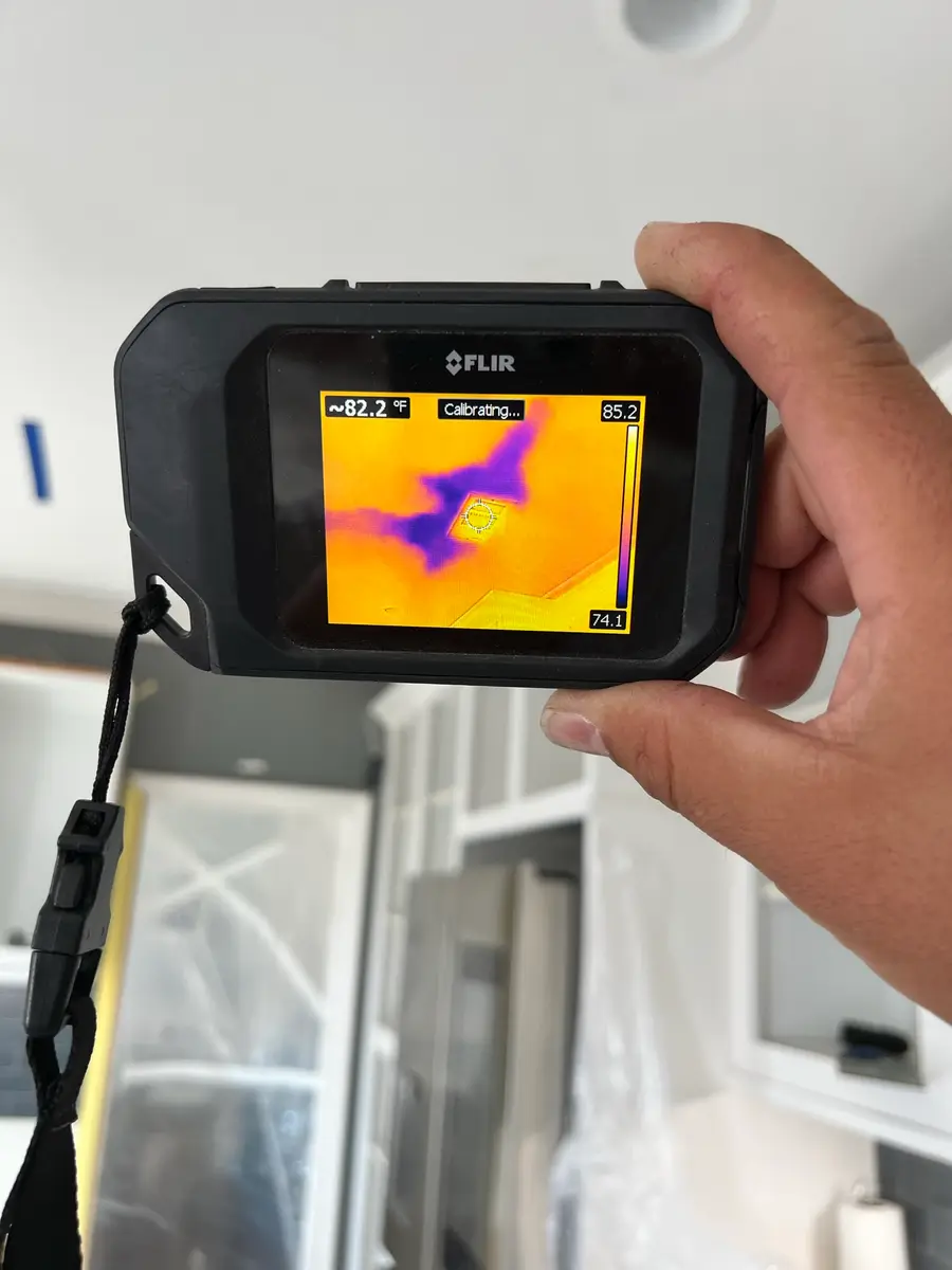 Thermal camera moisture reading during water damage inspection during San Jacinto water damage restoration project by PL Builders